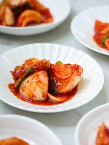Onion kimchi served in small white bowls