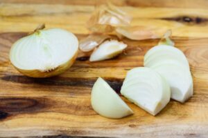 Cutting a small onion into wedges