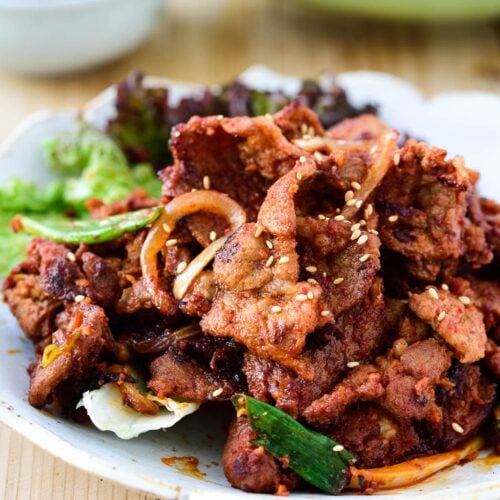 Spicy pork bulgogi served with lettuce wraps and ssamjang